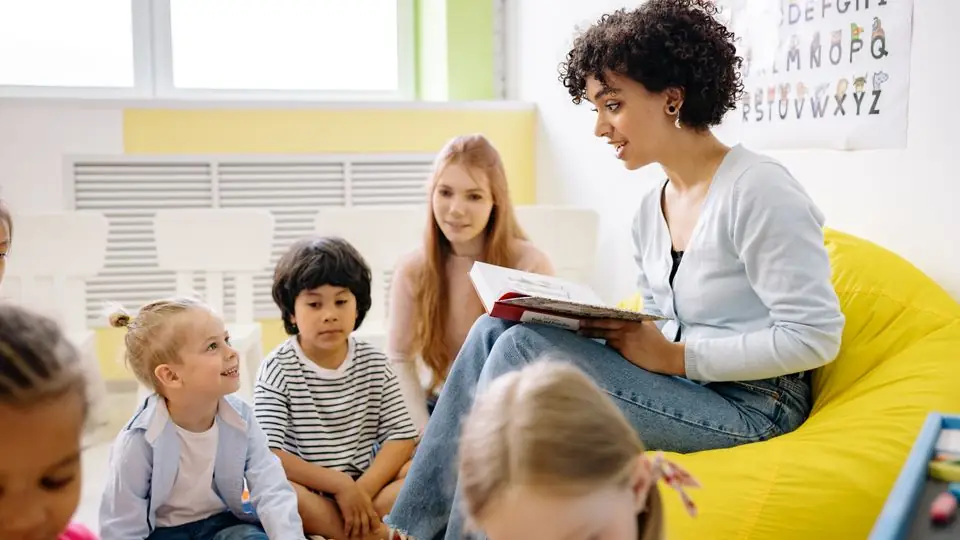 Teacher with young children in a classroom